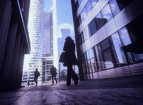 Businesswoman arriving at business district of Paris, France